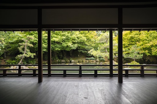 A beautiful garden view from inside a stylish veranda.