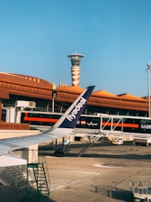 white and red airplane on airport during daytime