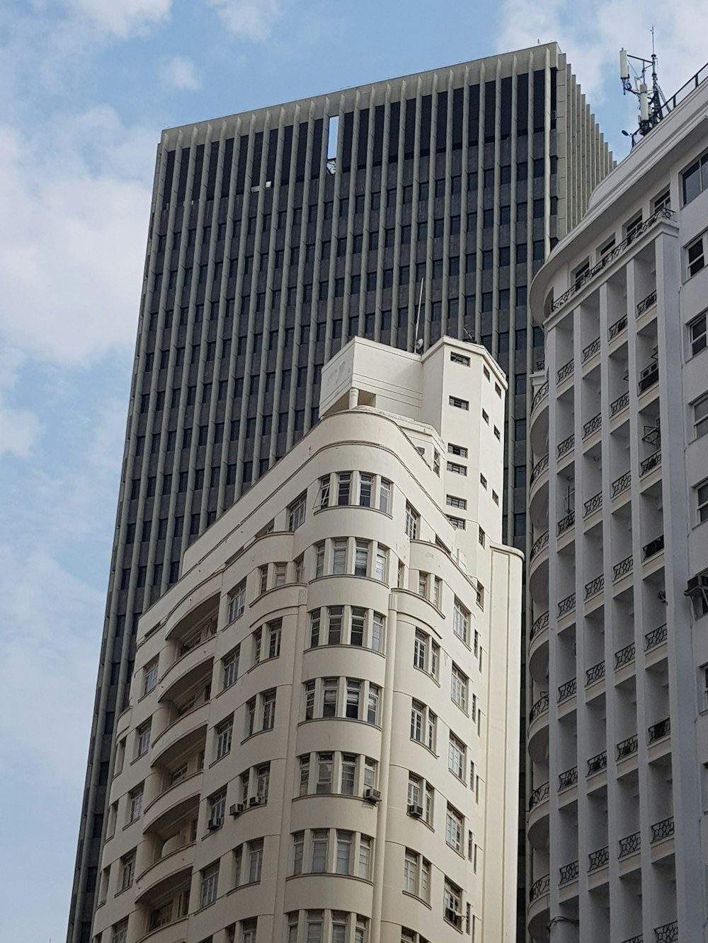 white and blue concrete building under blue sky during daytime