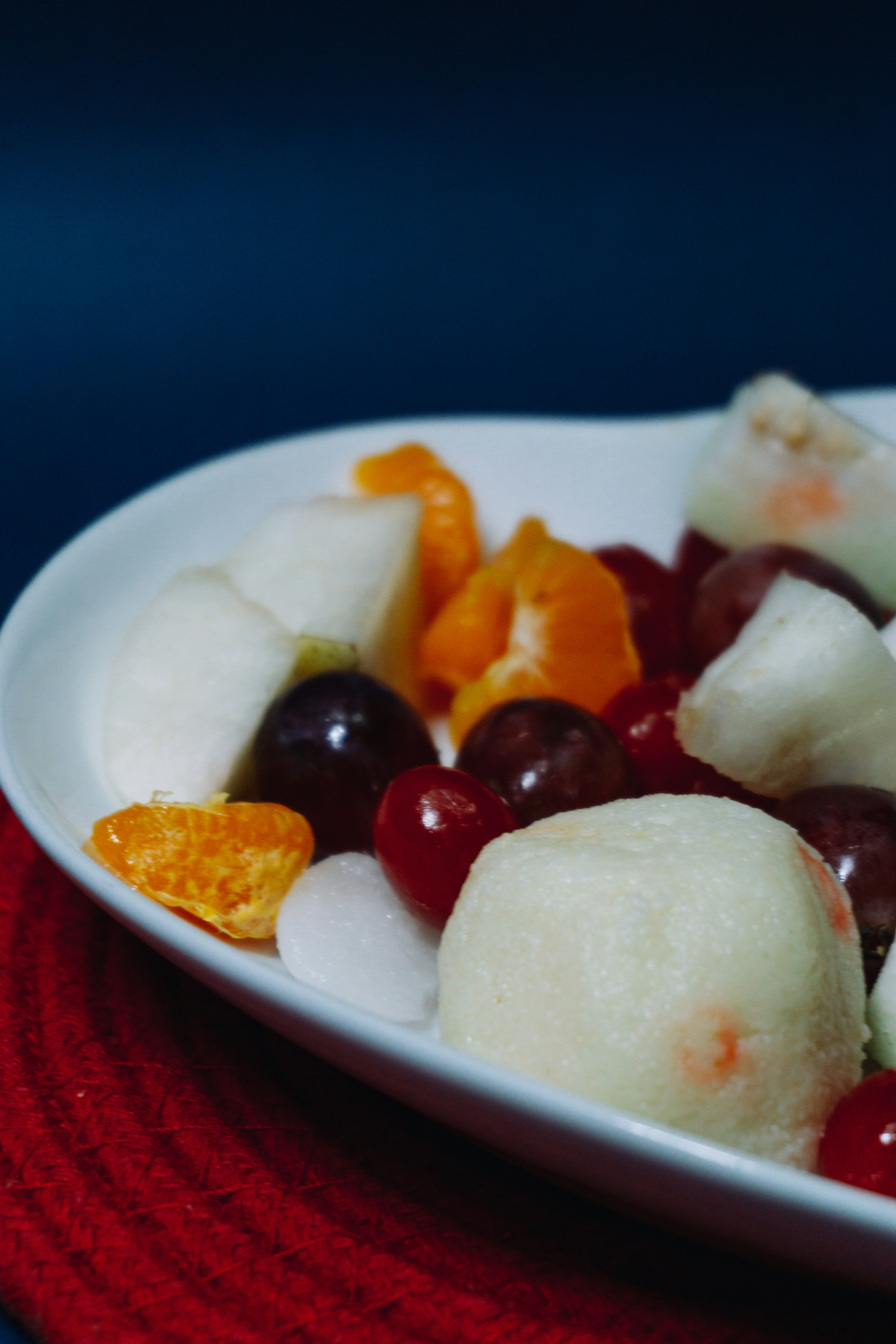 sliced fruits on white ceramic plate