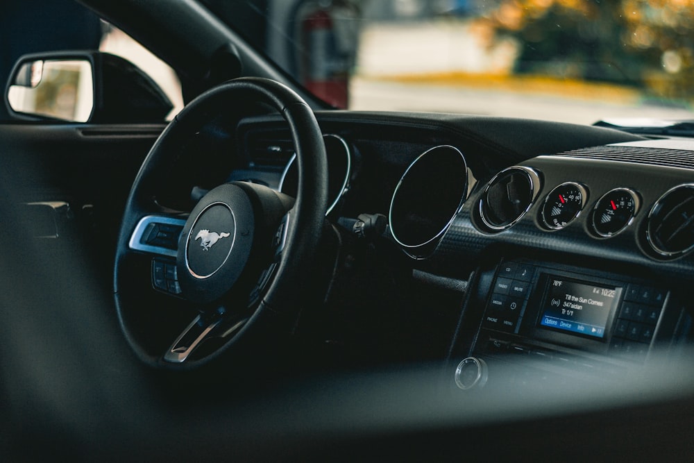 black and silver car steering wheel