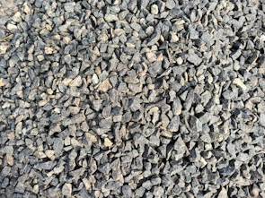 Close-up of crushed stone piles ready for construction use.
