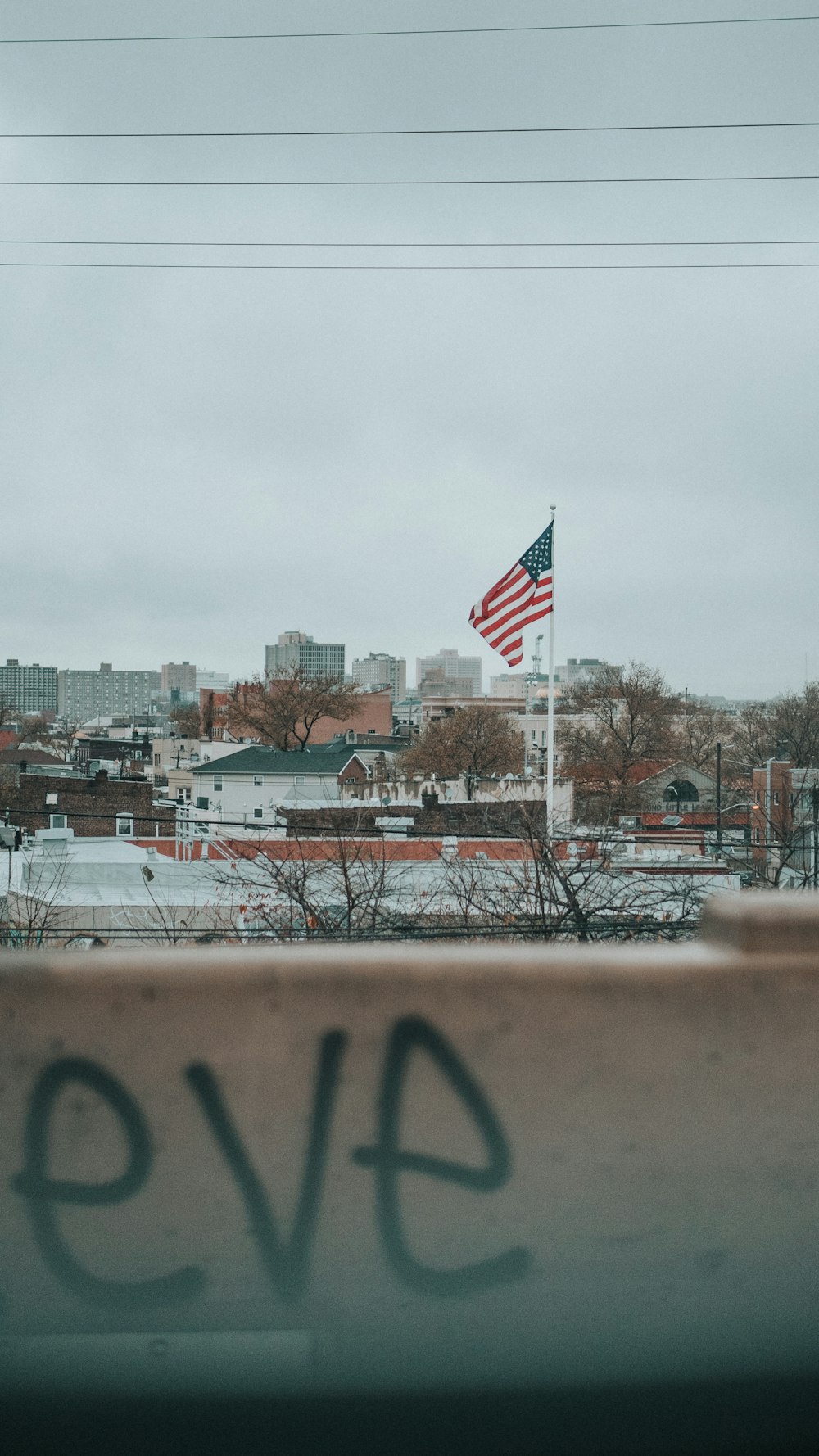 us a flag on brown metal fence