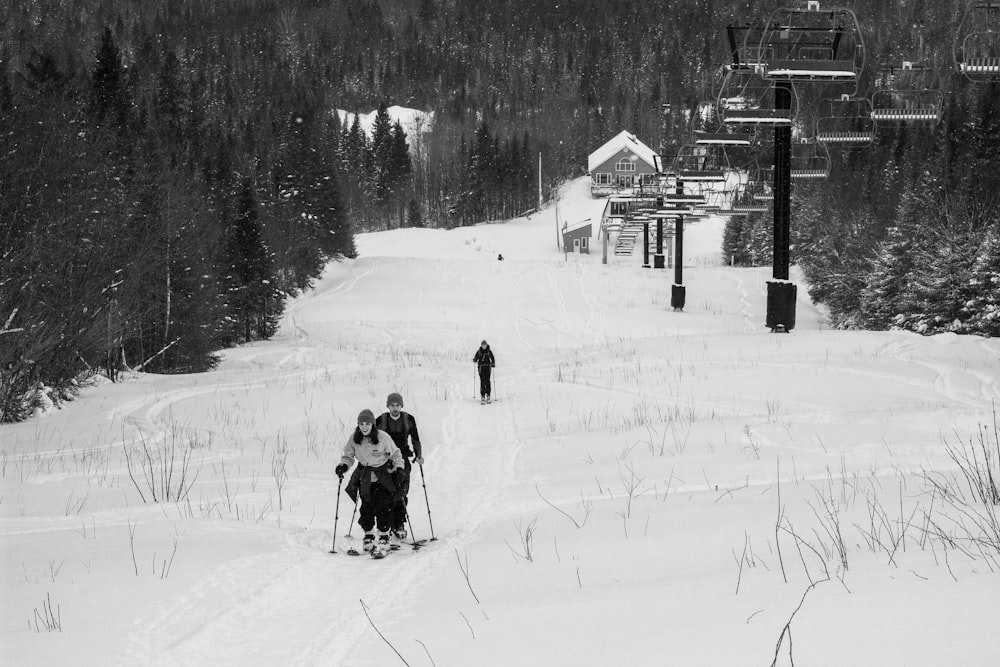 people walking on snow covered field during daytime