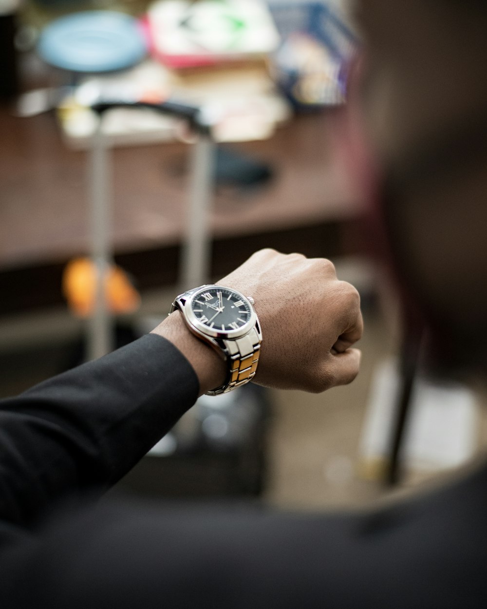 person wearing silver and white analog watch