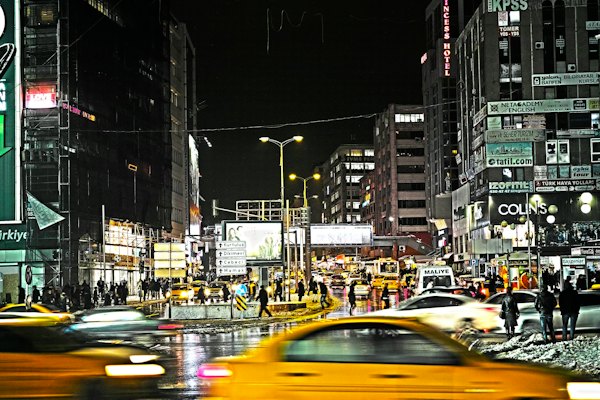 Cars on road between buildings during night time — Ankara, Turkey