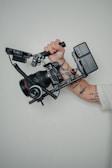 person holding black dslr camera