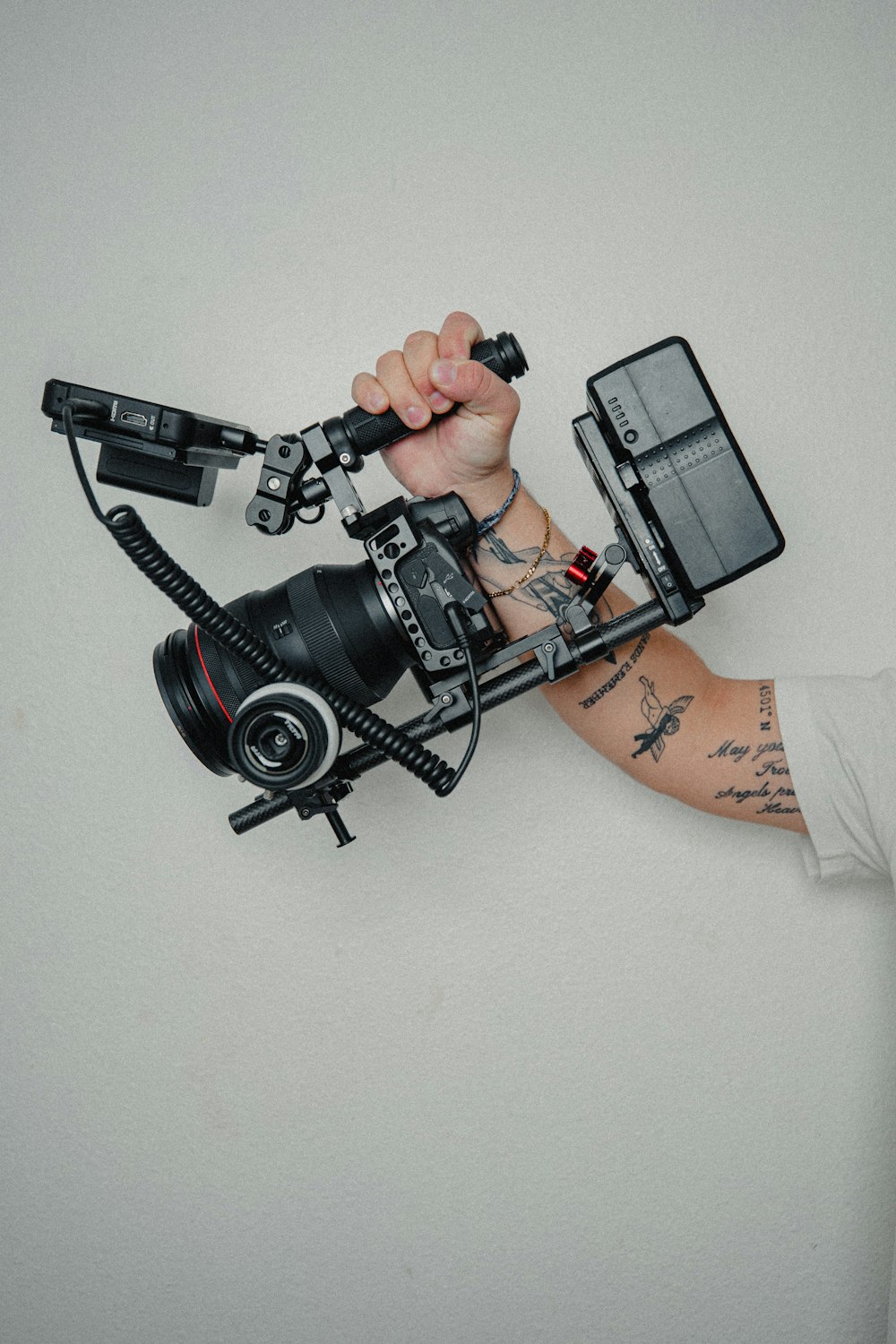 person holding black dslr camera