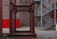 red metal frame on gray concrete floor