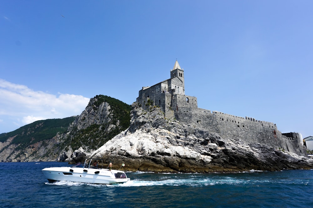 gray concrete building on top of gray rock formation during daytime