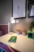 A vibrant study space with colorful books and stationery.
