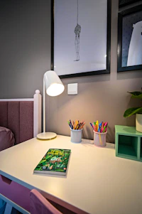 A bright and cheerful study corner with pencils, a globe, and a calendar marking upcoming workshops.