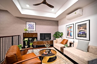 black flat screen tv on brown wooden tv rack