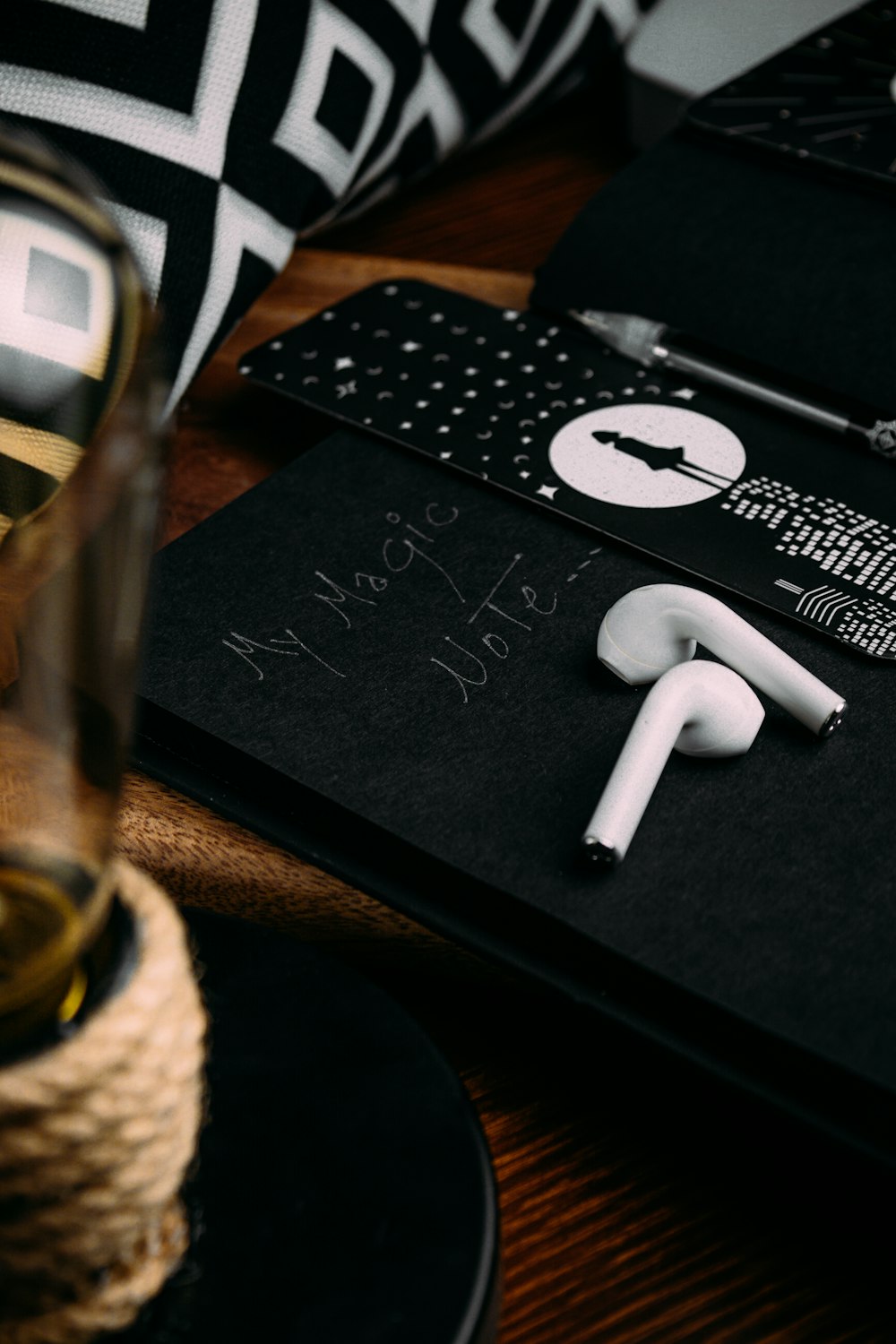 white earbuds on black book