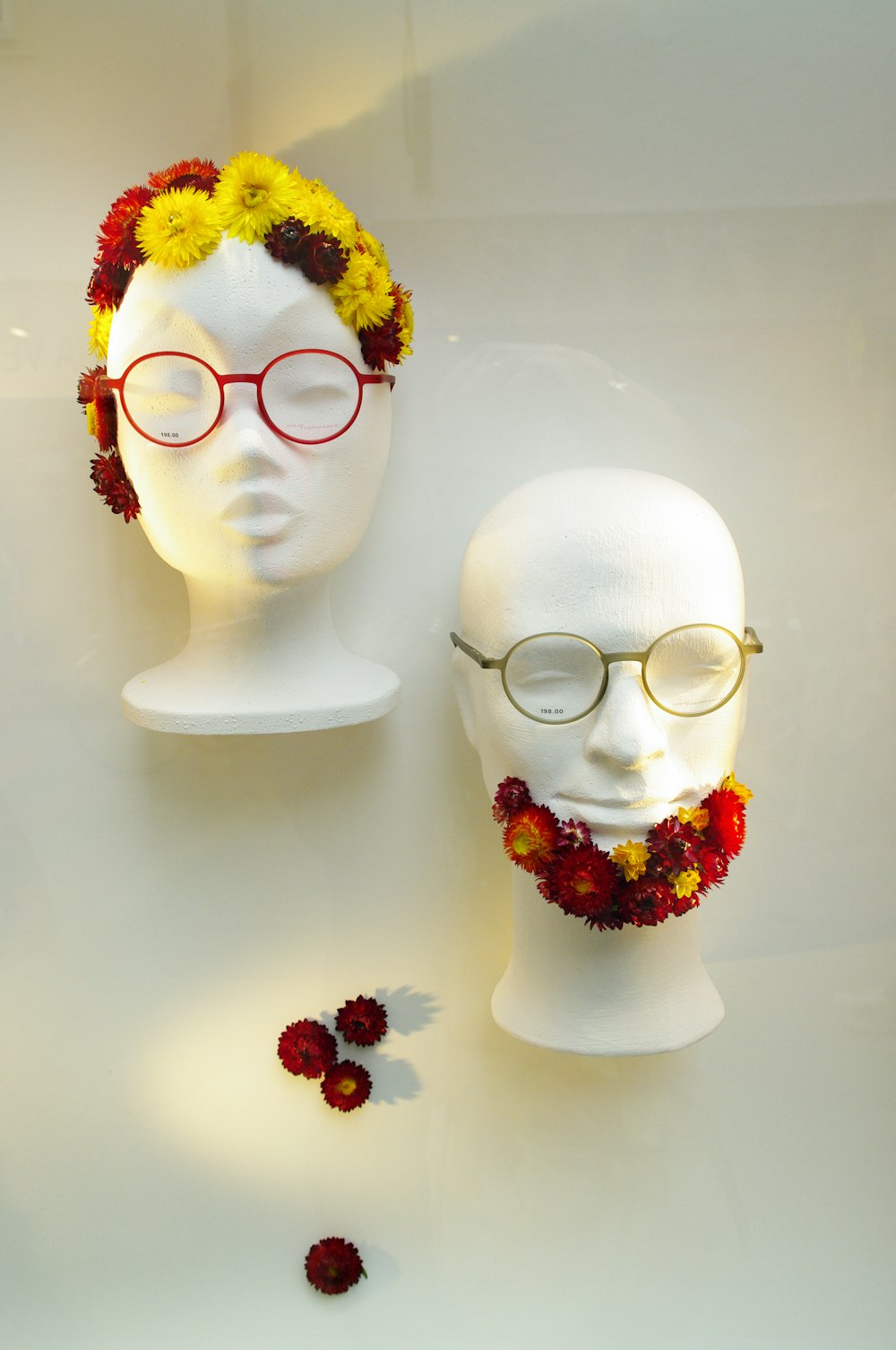 white ceramic figurine with yellow and red flower