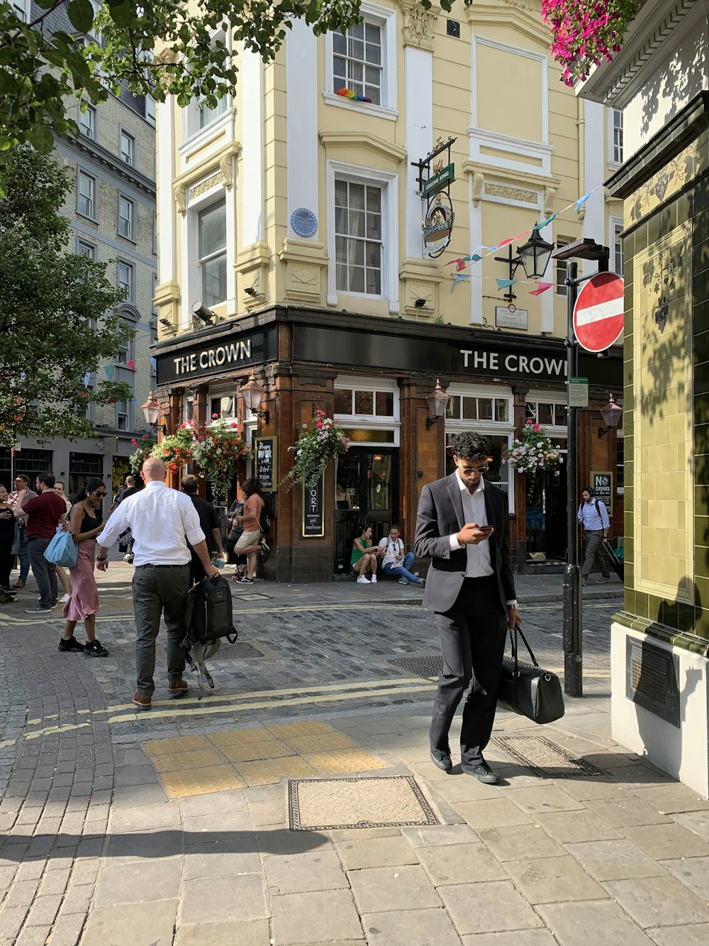 people walking on sidewalk during daytime