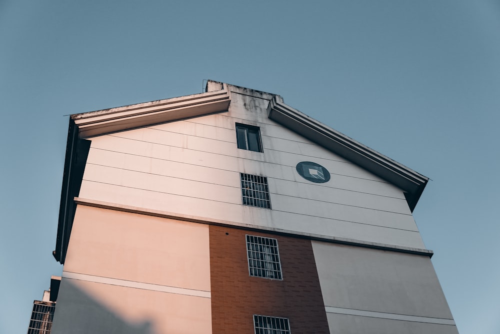 white and brown concrete building under blue sky during daytime