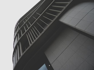 Modern architectural facade of a sleek residential building designed by Grupo Arcadi.