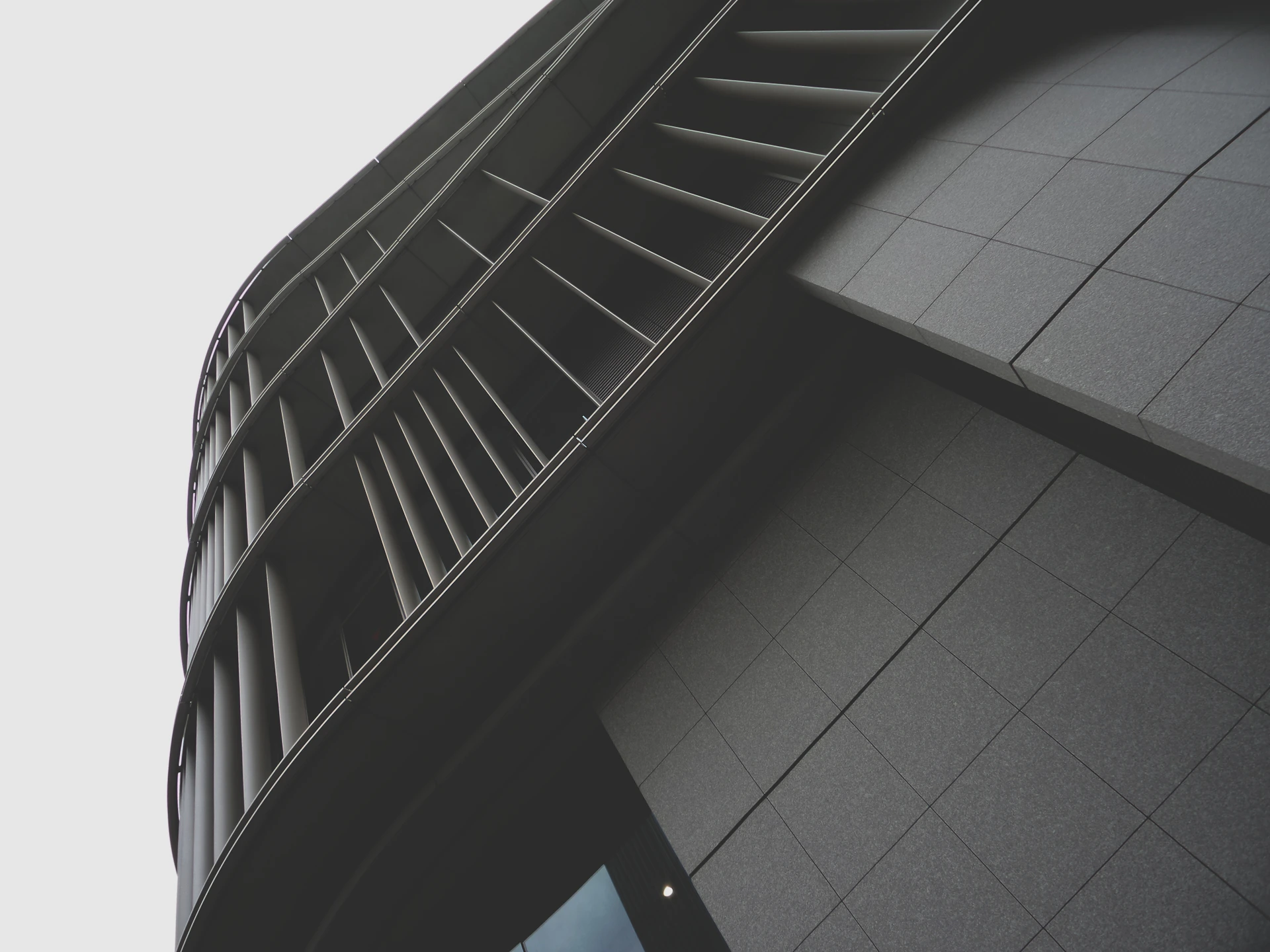 A striking exterior shot of a prestigious building designed by Lucie Toussaint Architecture, highlighting its refined facade and artistic flair.
