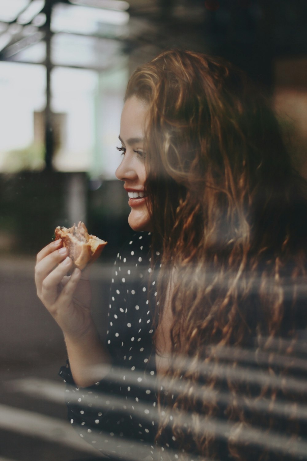 woman holding brown leaf during night time