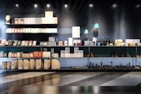 Close-up of neatly arranged products on display shelves in a bright store.