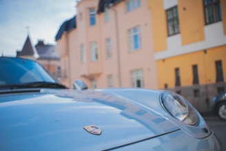 Close-up of a gleaming luxury car hood freshly detailed by autoluxx in a sunlit Dubai villa driveway.