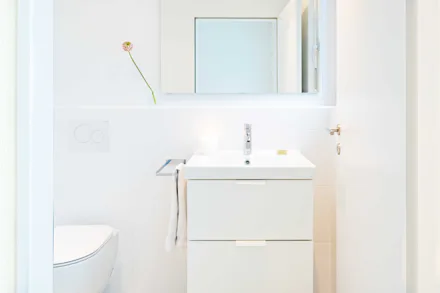 Drain cleaning service clearing a clogged kitchen drain