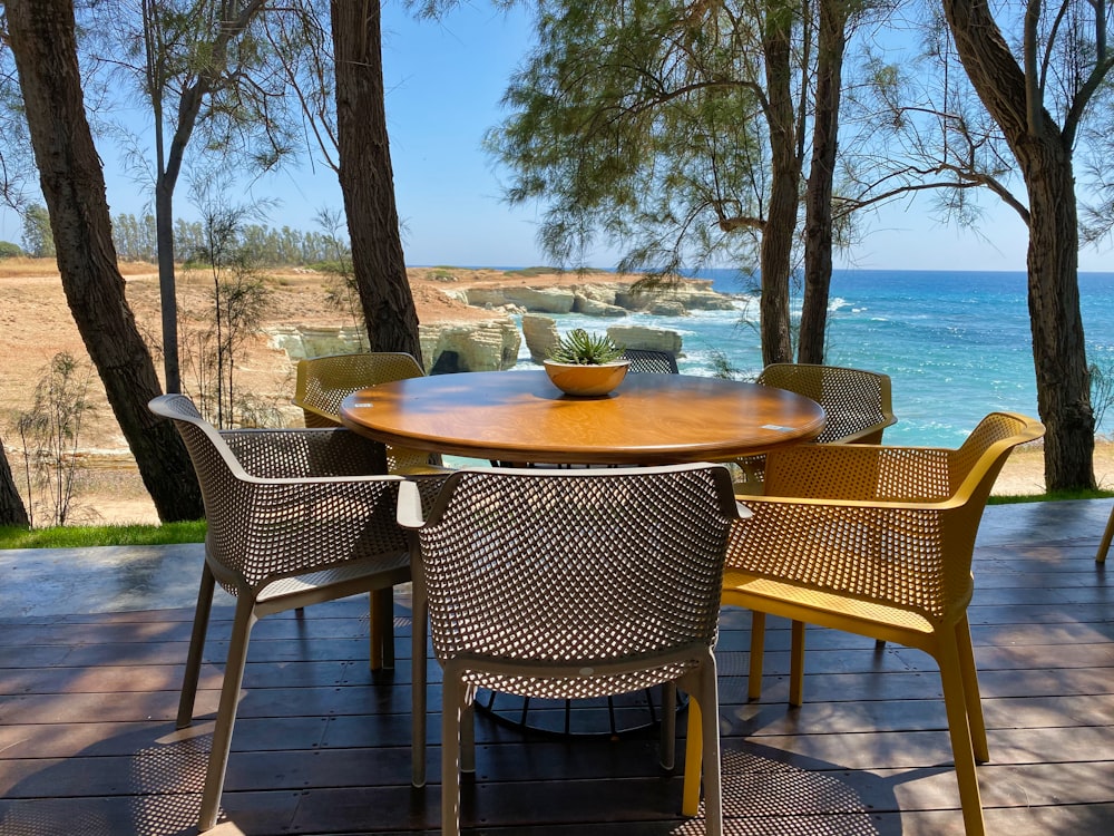 brown wooden table with chairs