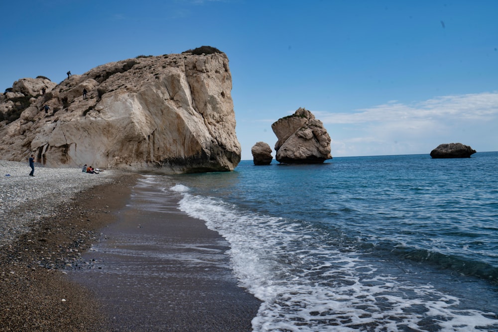 brown rock formation on sea shore during daytime