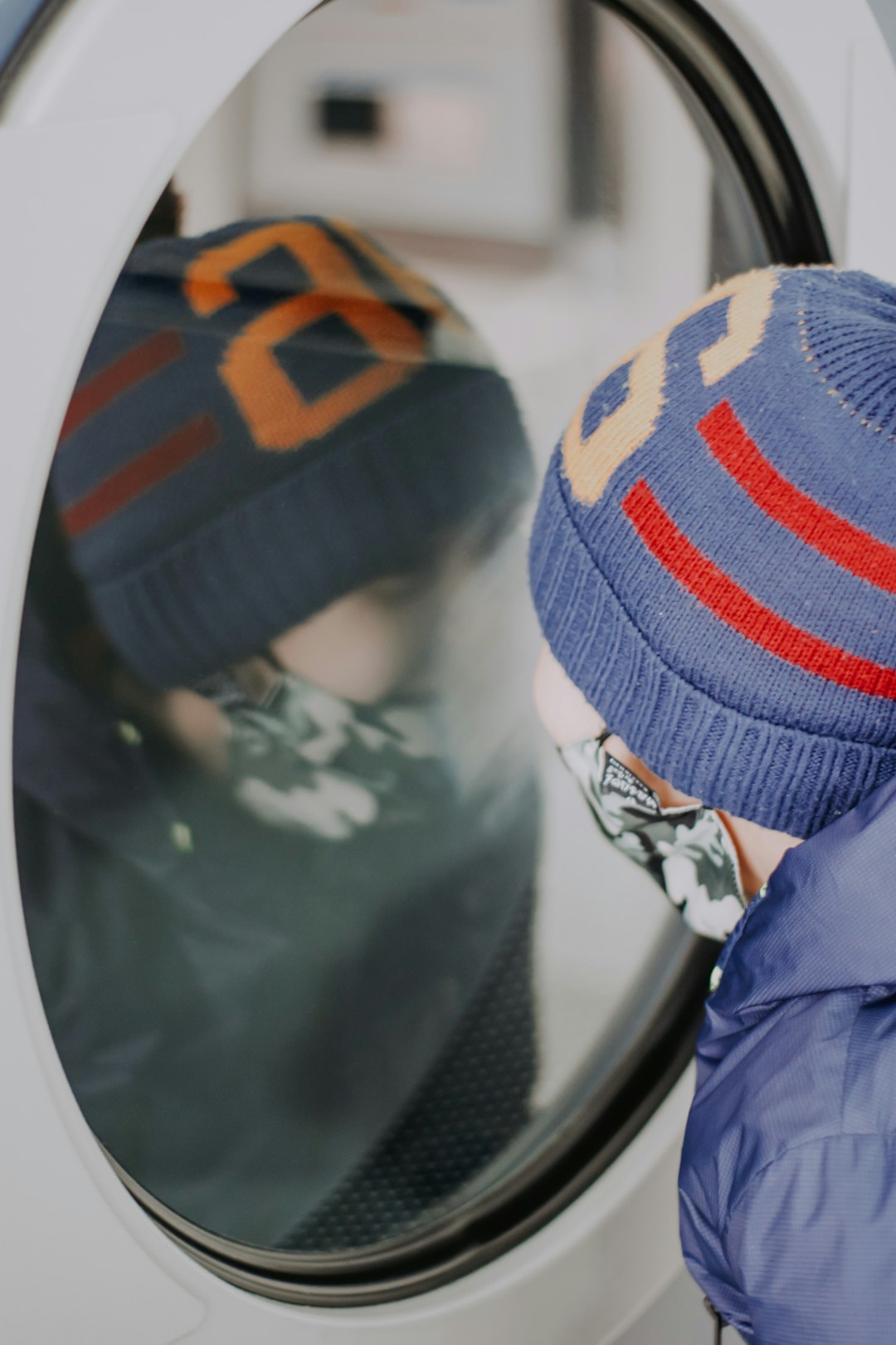 person in blue jacket wearing blue knit cap