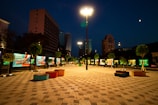 Night view of a well-lit urban plaza improved for public safety.