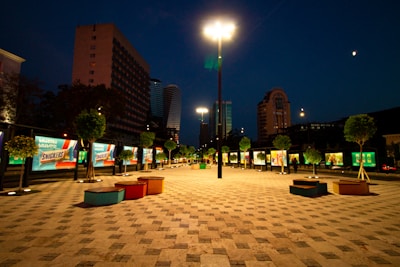 Night view of a commercial plaza with lights.