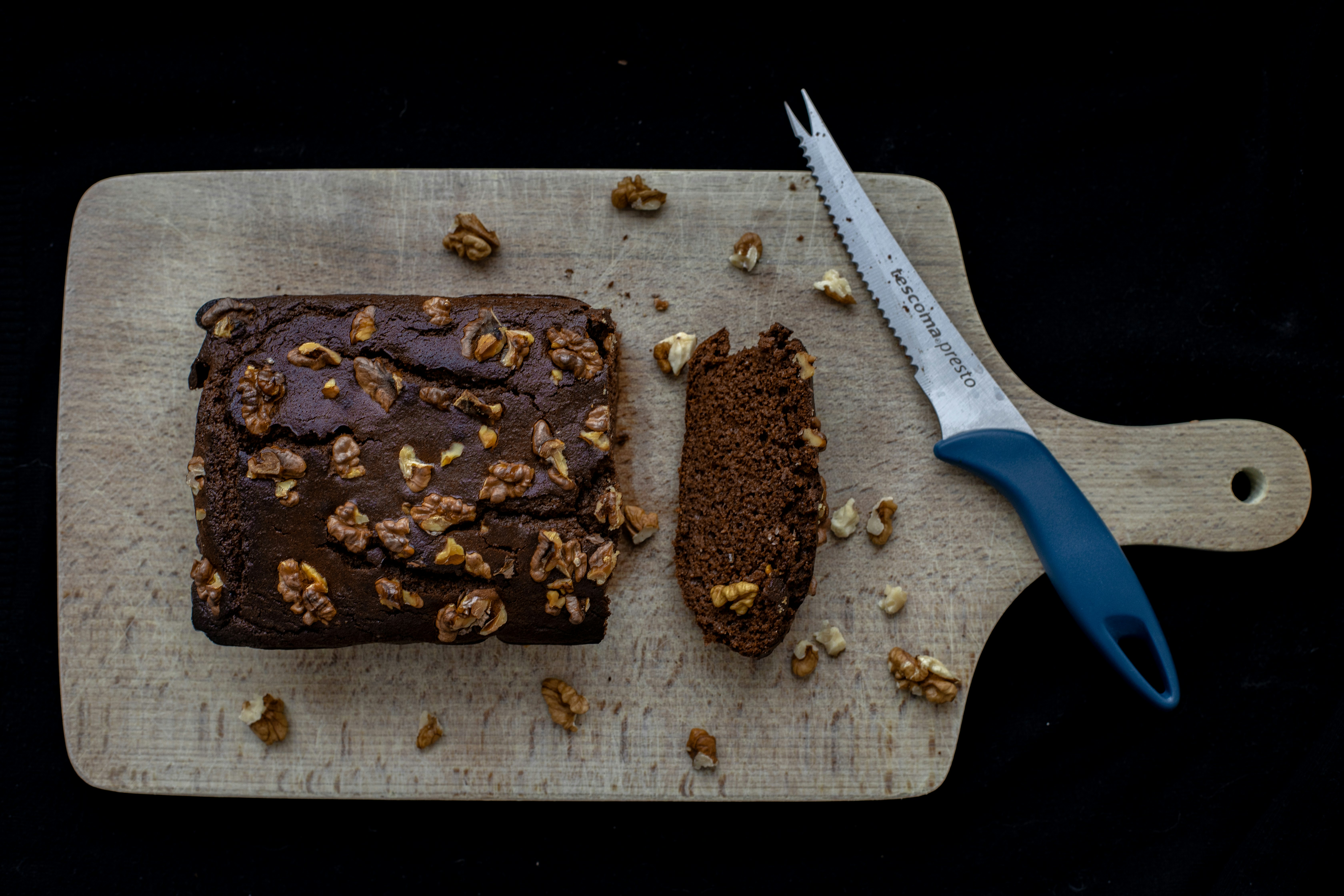 chocolate cake on brown wooden chopping board