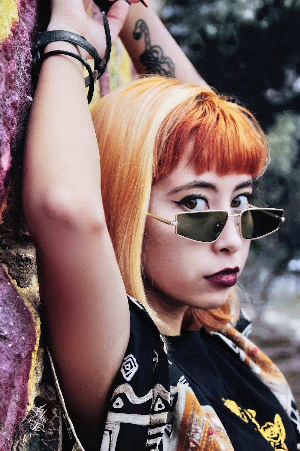 woman in black tank top wearing black sunglasses