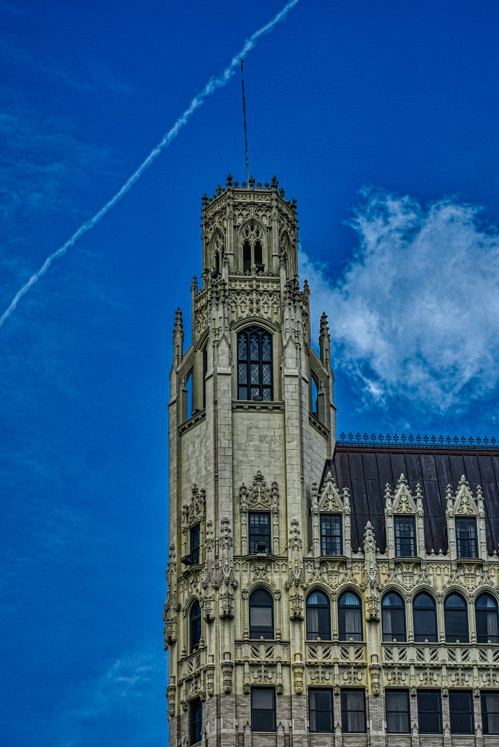 brown concrete building under blue sky during daytime