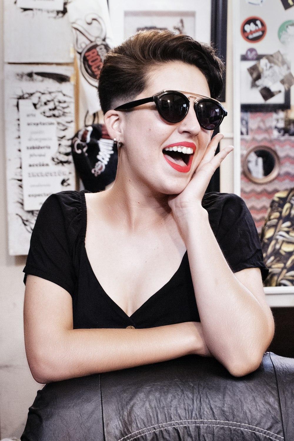 woman in black v neck shirt wearing black sunglasses