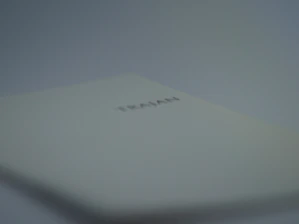 Close-up of an open TRAI book edition with digital innovation graphics overlay.