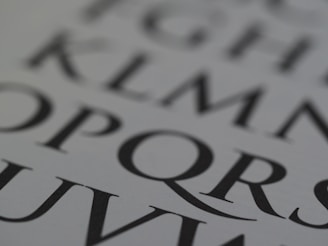 Close-up of sharp typography on a dark-themed recruitment website interface.