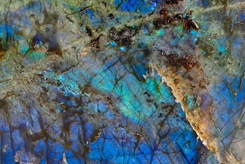 Close-up of a polished slab of vibrant blue exotic natural stone with intricate white veining.