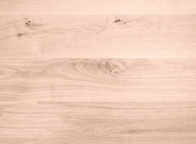 Maple wood surface with a smooth, creamy finish and subtle grain.