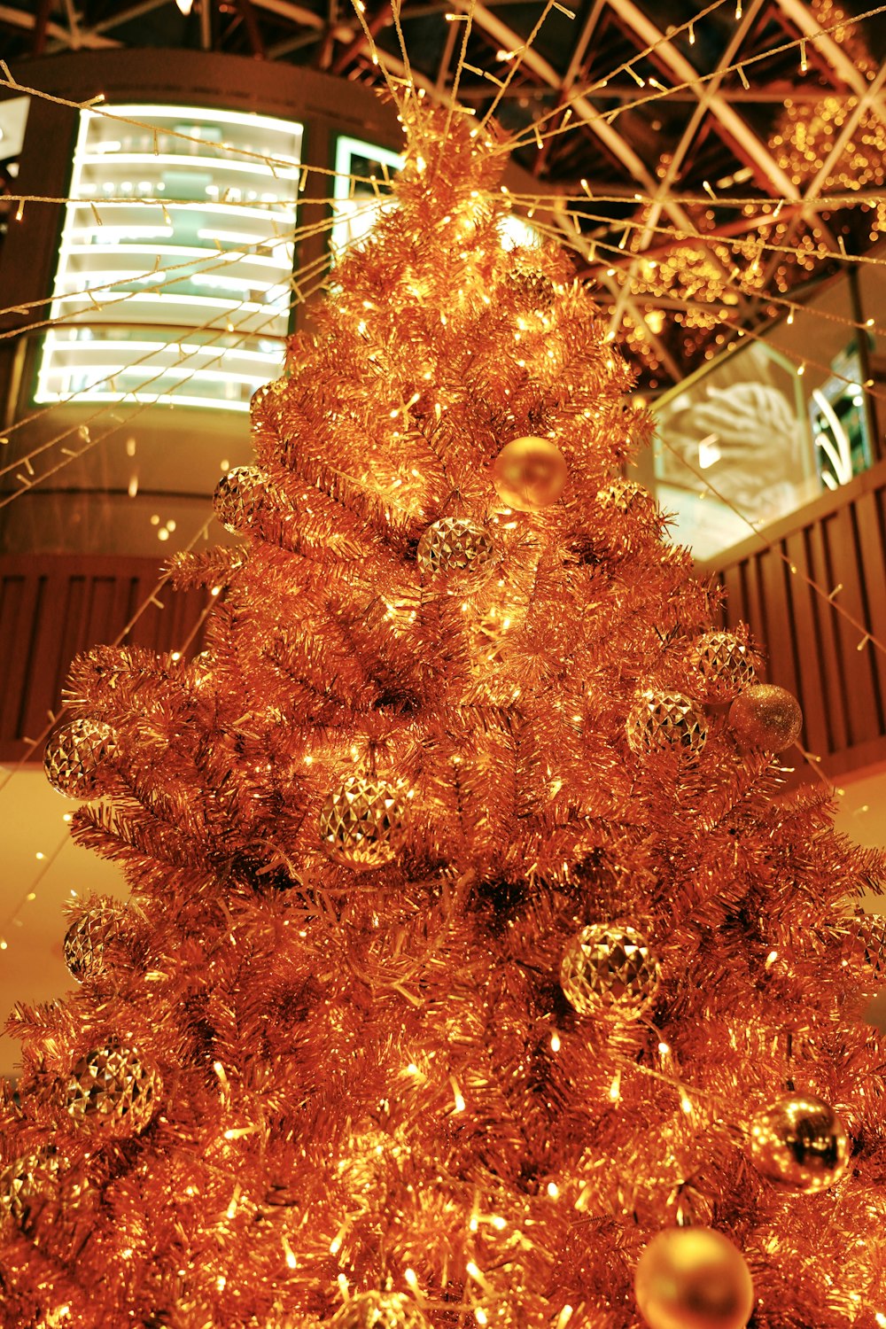 gold christmas tree with gold baubles