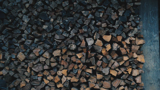 A close-up of colorful fire starters in black, red, orange, and white hues arranged neatly.