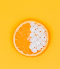 orange fruit slices on yellow surface