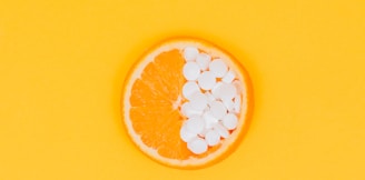 orange fruit slices on yellow surface