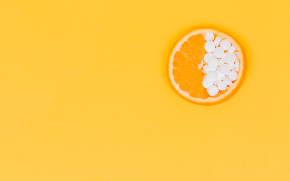 orange fruit with white round fruits