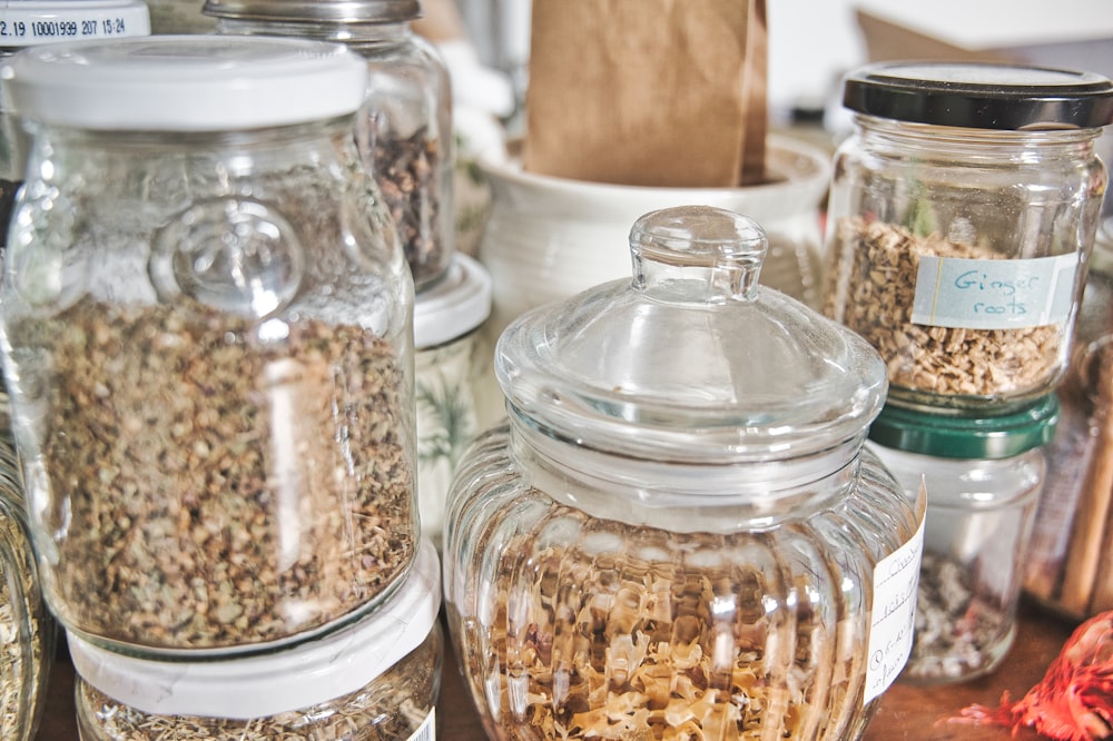 clear glass jar with brown powder inside