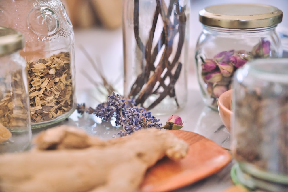 clear glass jar on brown wooden chopping board