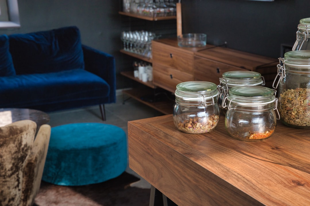 clear glass jar on brown wooden table