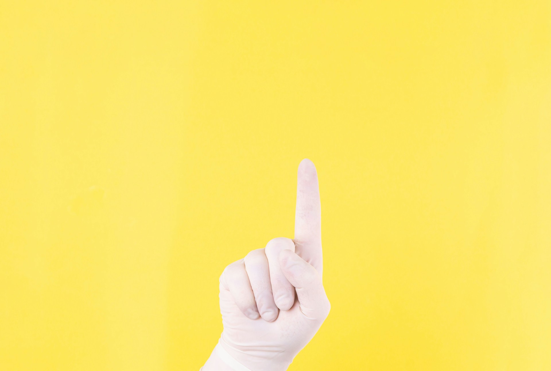 persons left hand doing thumbs up sign