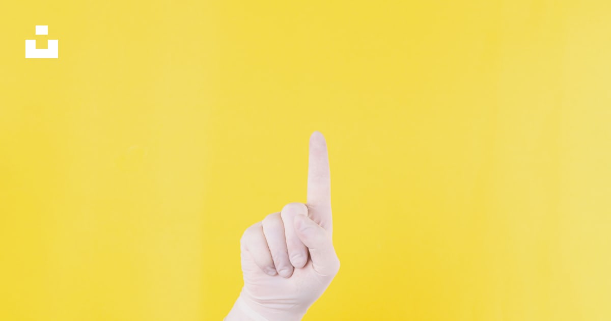 Persons left hand doing middle finger sign photo – Free Glove Image on ...